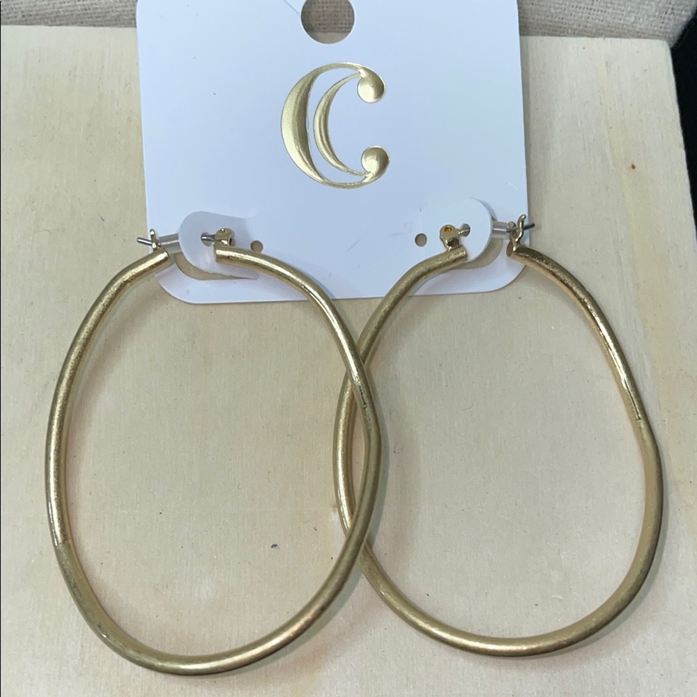 NWT gold tone, wavy large hoops